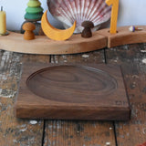 Mader walnut medium wooden spinning plate 15cm placed on a wooden surface in the Babipur playroom.