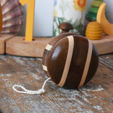 Mader natural freewheel yoyo placed on a wooden surface in the Babipur playroom.