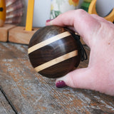 Mader natural yoyo in an adult hand in the Babipur playroom.