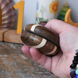 Mader natural yoyo in an adult hand in the Babipur playroom.