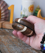 Mader natural yoyo in an adult hand in the Babipur playroom.