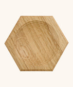 Mader handcrafted small oak spinning top plate in a shape of a hexagon. Plare measure 8cm