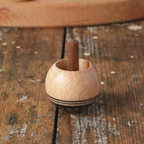 Mader orient turn-over spinning top placed on a wooden desk in the Babipur playroom.