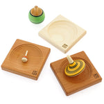 Mader spinning tops on 3 mader mini spinning plates on a white background