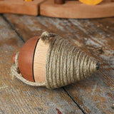 Mader natural profi throw spinning top placed on a wooden surface in the Babipur playroom. 