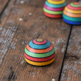Mader striped wooden magnet placed on a desk in the Babipur playroom.