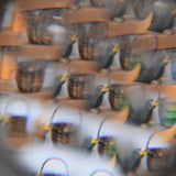 Mader Rainbow Kaleidoscope view through the lens of a an Ostheimer blackbird and a kraul basket. 