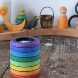 Mader Rainbow Kaleidoscope placed on a desk in the Babipur playroom. Decorated Grimm's celebration ring in the background.