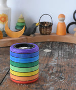 Mader Rainbow Kaleidoscope placed on a desk in the Babipur playroom. Decorated Grimm's celebration ring in the background.