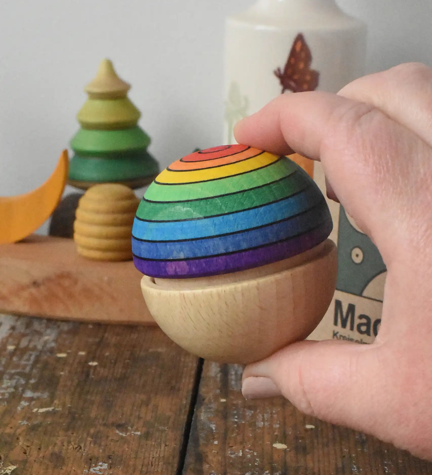 Mader Kreiselmanufaktur in an adult's hand.