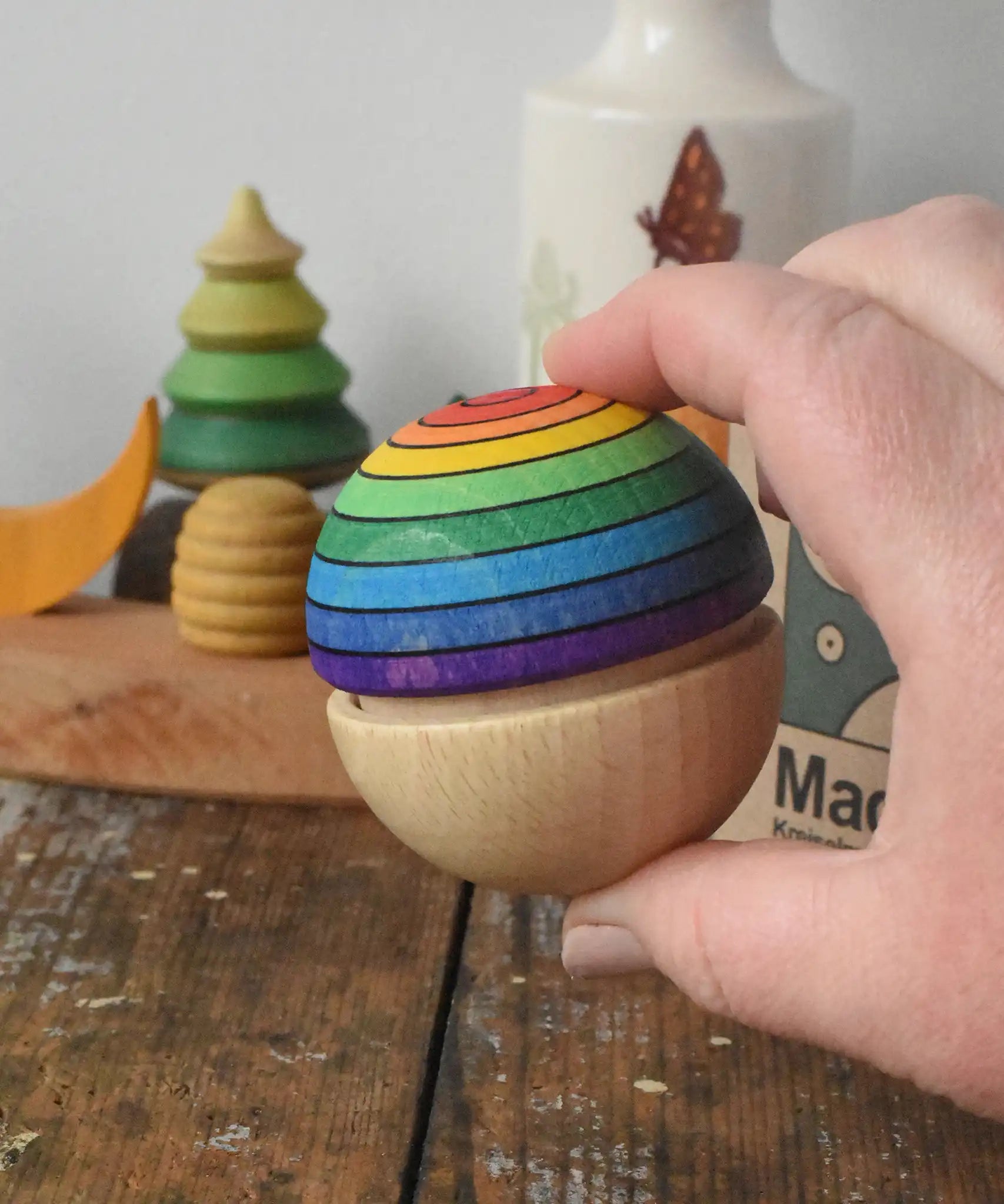 Mader Kreiselmanufaktur in an adult's hand.