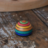 Mader striped wooden magnet placed on a desk in the Babipur playroom.