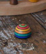 Mader striped wooden magnet placed on a desk in the Babipur playroom.