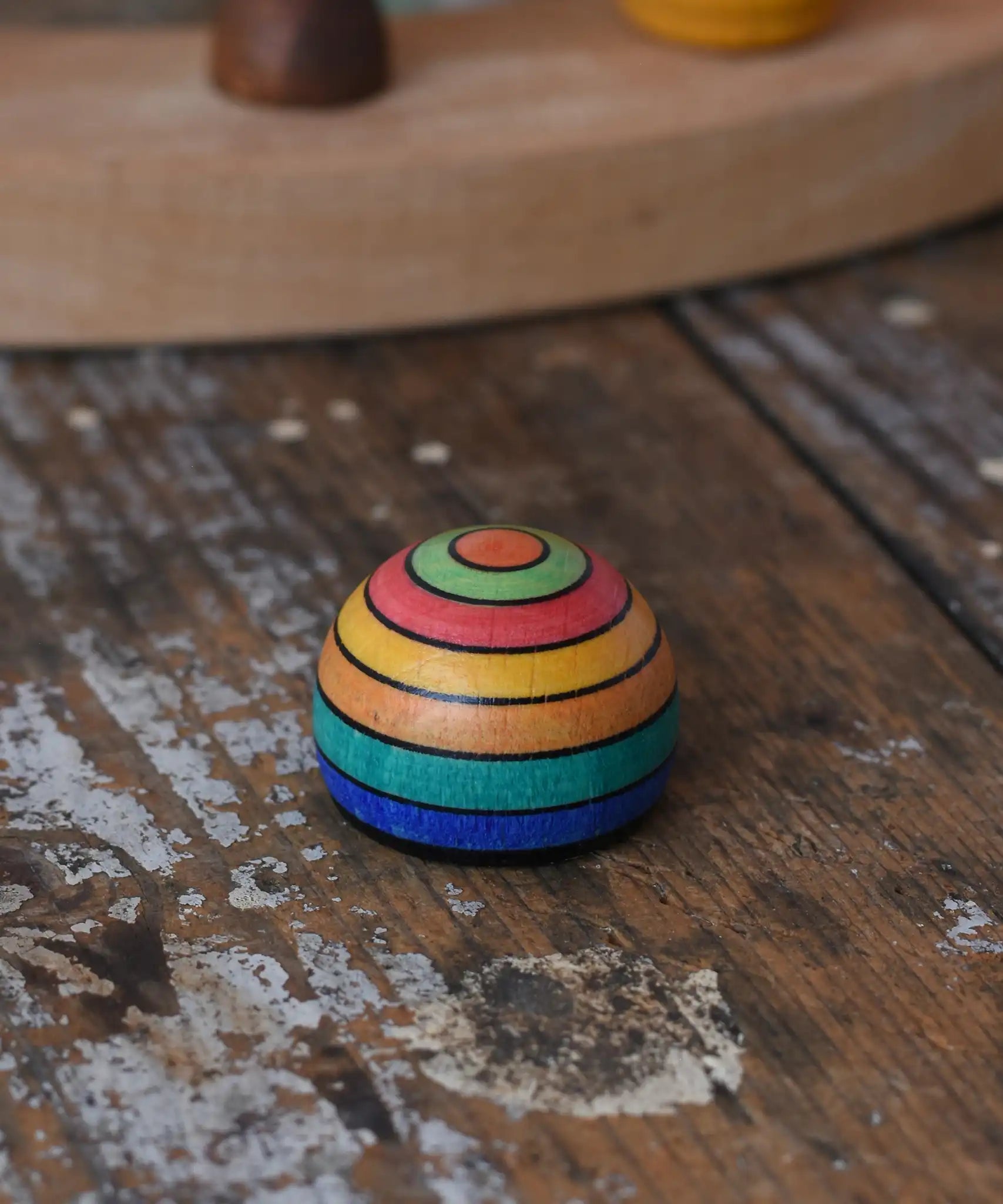 Mader striped wooden magnet placed on a desk in the Babipur playroom.