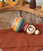Mader Kreiselmanufaktur Ring Spinning Top placed on a wooden surface in the Babipur playroom.