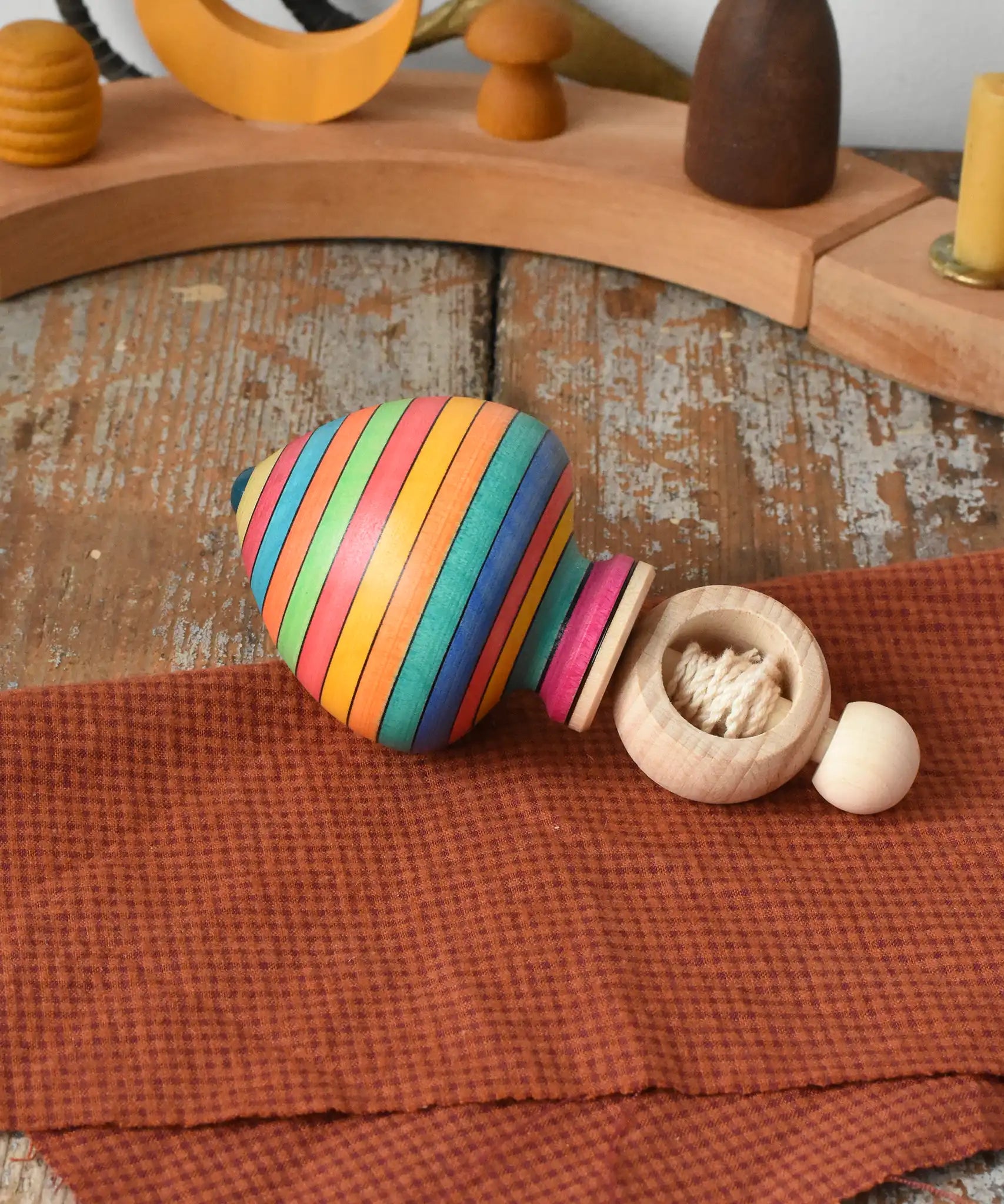 Mader Kreiselmanufaktur Ring Spinning Top placed on a wooden surface in the Babipur playroom.