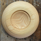 Bottom of the Mader Kreiselmanufaktur Rondell Ash Wood 40cm Spinning Plate placed on a wooden surface in the Babipur playroom.