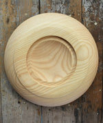 Bottom of the Mader Kreiselmanufaktur Rondell Ash Wood 40cm Spinning Plate placed on a wooden surface in the Babipur playroom.
