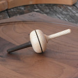 Mader Salto Totale wooden spinning to placed on a walnut spinning plate in the Babipur playroom.
