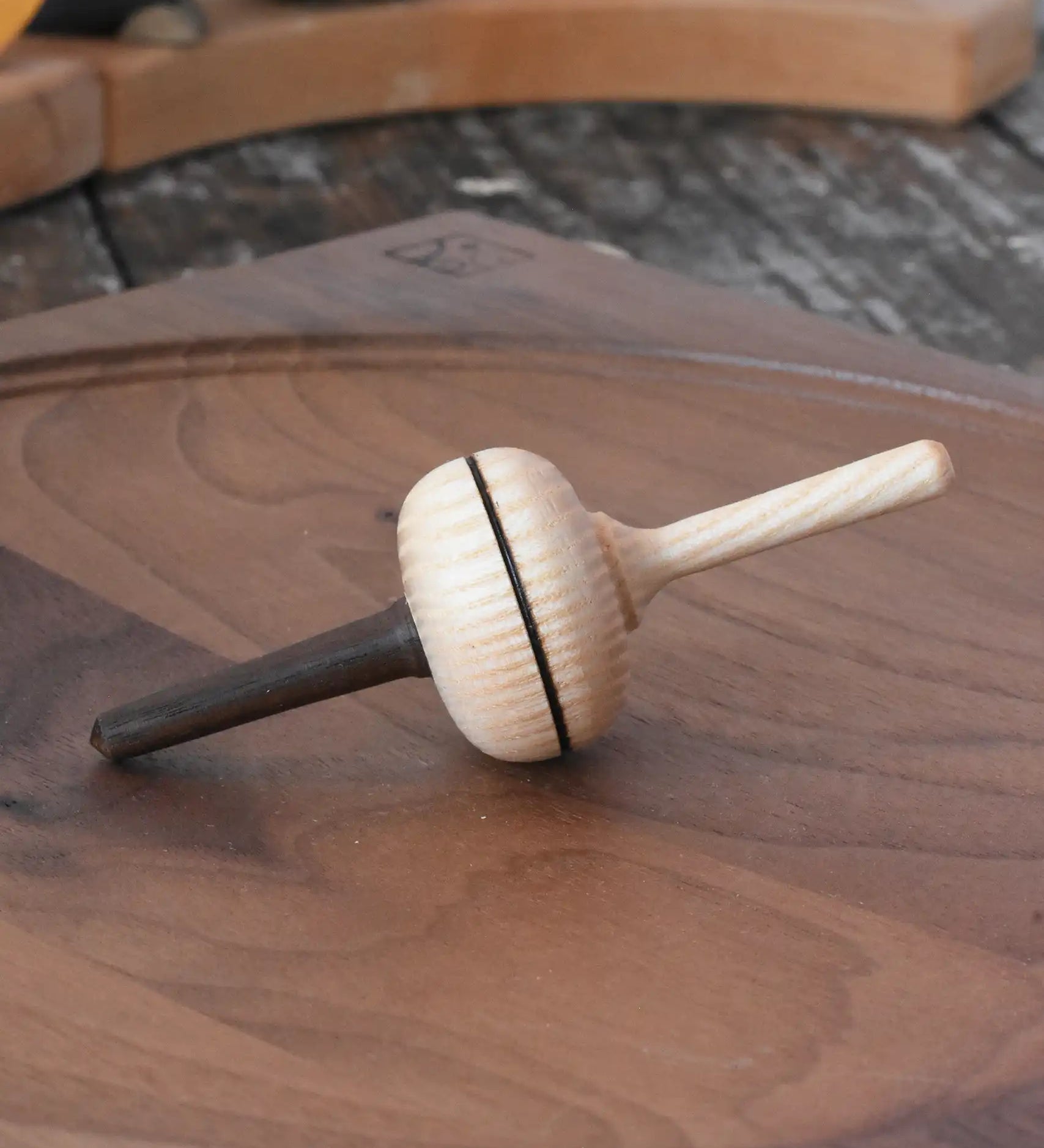 Mader Salto Totale wooden spinning to placed on a walnut spinning plate in the Babipur playroom.