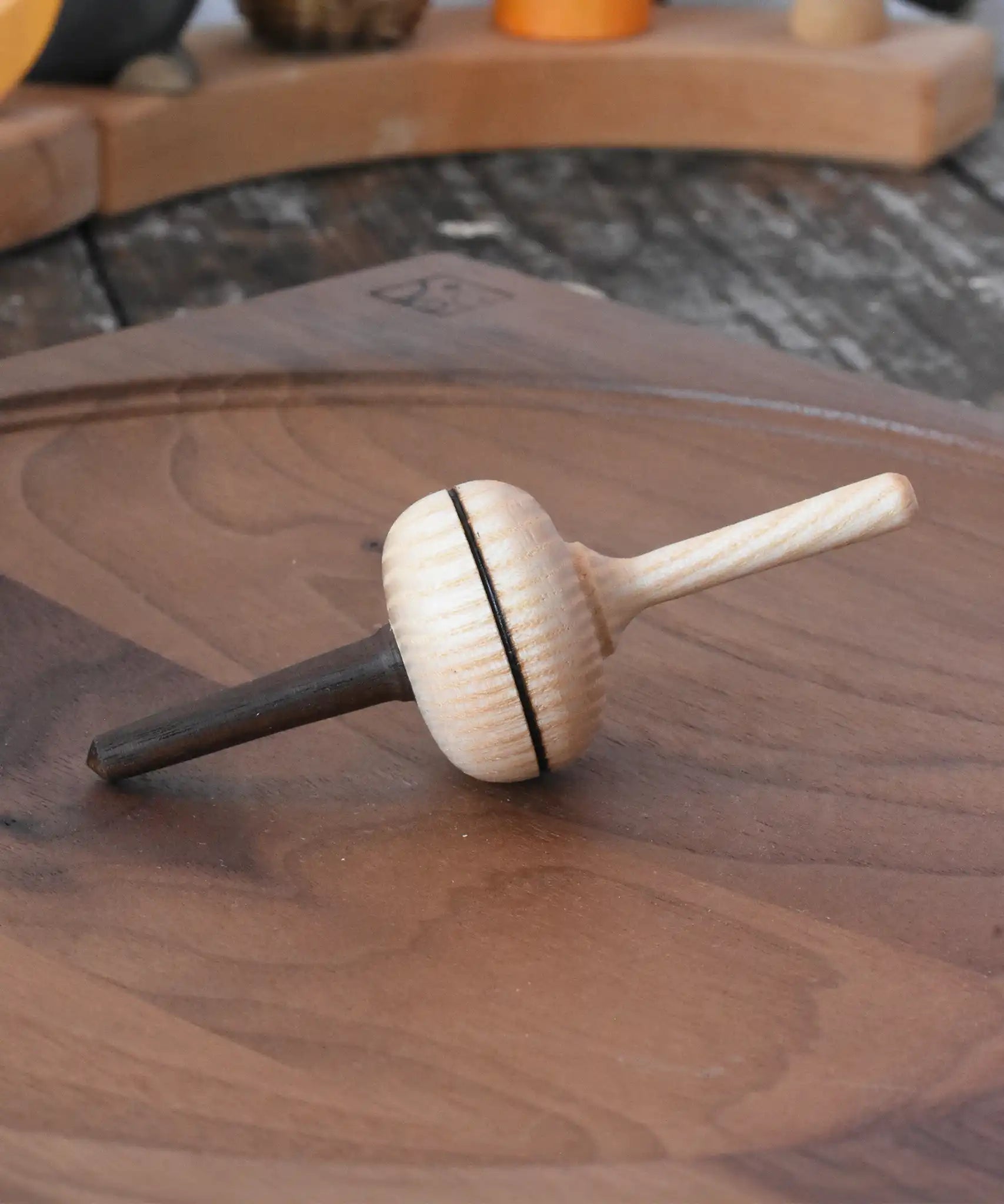 Mader Salto Totale wooden spinning to placed on a walnut spinning plate in the Babipur playroom.