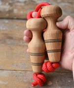 Mader Kreiselmanufaktur Children's Skipping Rope with Natural Handles in an adult hand.