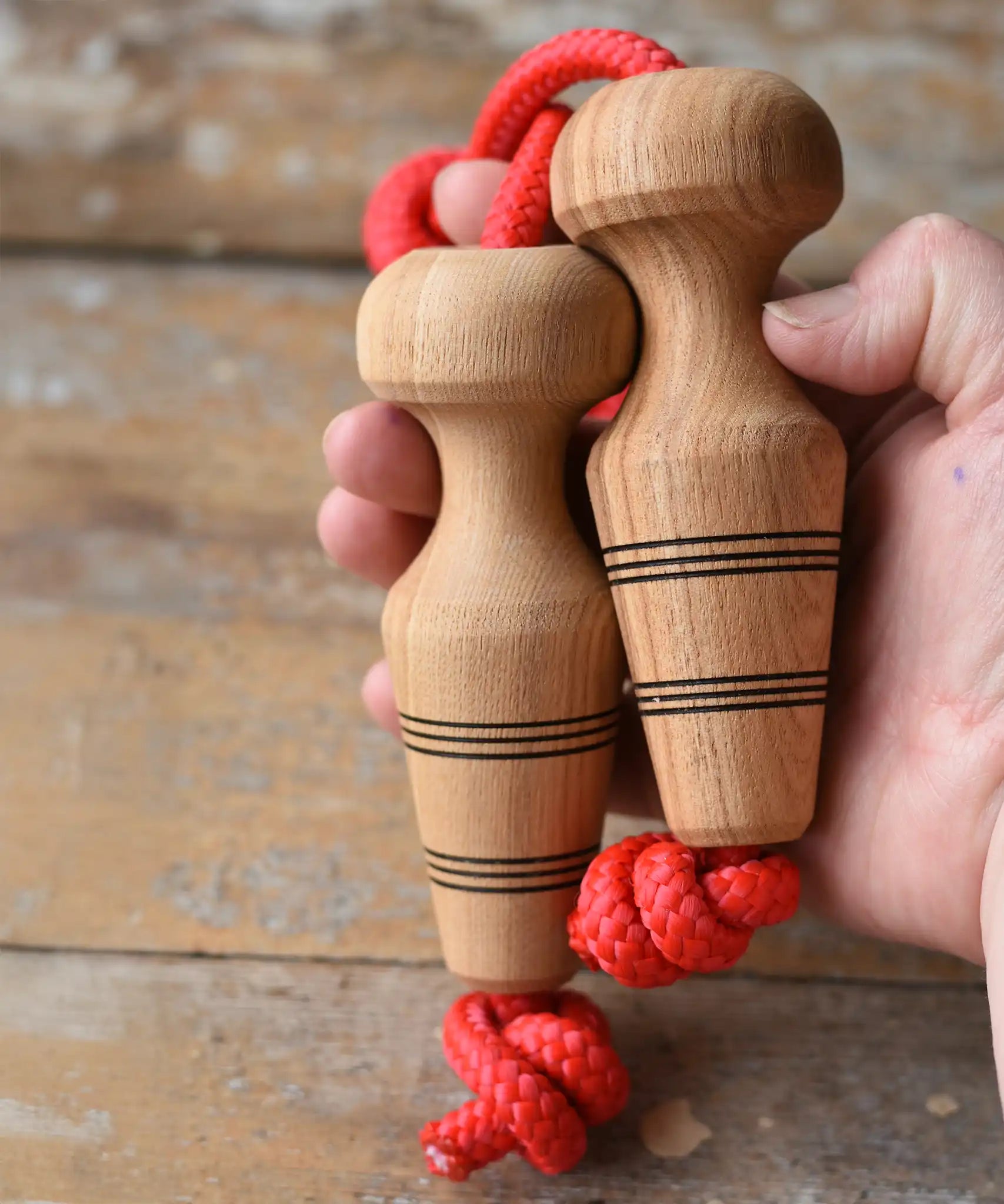 Mader Kreiselmanufaktur Children's Skipping Rope with Natural Handles in an adult hand.