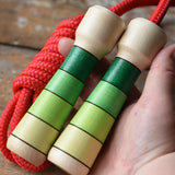 Mader Skipping Rope with Green Handles in an adult hand. 