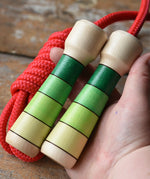 Mader Skipping Rope with Green Handles in an adult hand. 