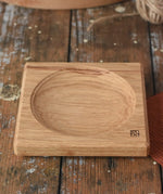 Mader Small Oak Spinning Plate placed on a wooden surface in the Babipur playroom.