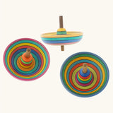 Three Mader Kreiselmanufaktur Sombrero Spinning Tops with a rainbow coloured striped design.