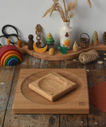 Mader Small Oak Spinning Plate placed on large 25cm spinning plate  in the Babipur playroom. Grimm's celebration ring set up in the background.