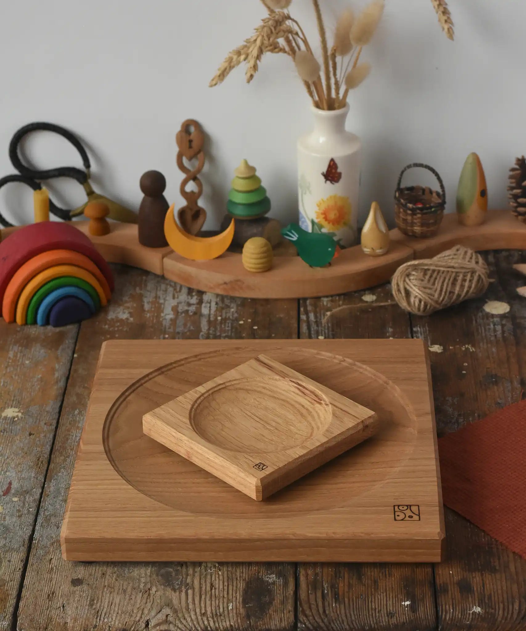 Mader Small Oak Spinning Plate placed on large 25cm spinning plate  in the Babipur playroom. Grimm's celebration ring set up in the background.