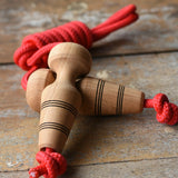 Mader Kreiselmanufaktur Children's Skipping Rope with Natural Handles placed on a wooden surface in the Babipur playroom. 