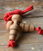 Mader Kreiselmanufaktur Children's Skipping Rope with Natural Handles placed on a wooden surface in the Babipur playroom. 