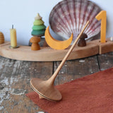 Mader trumpo spinning top 55mm placed on a wooden surface in the Babipur playroom.