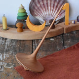 Mader trumpo spinning top 75mm placed on a wooden surface in the Babipur playroom.