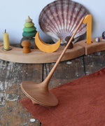Mader trumpo spinning top 75mm placed on a wooden surface in the Babipur playroom.