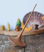 Mader trumpo spinning top 75mm placed on a wooden surface in the Babipur playroom.