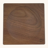 Mader handcrafted walnut square medium spinning top plate. Showing the logo on the bottom corner