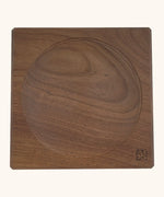 Mader handcrafted walnut square medium spinning top plate. Showing the logo on the bottom corner