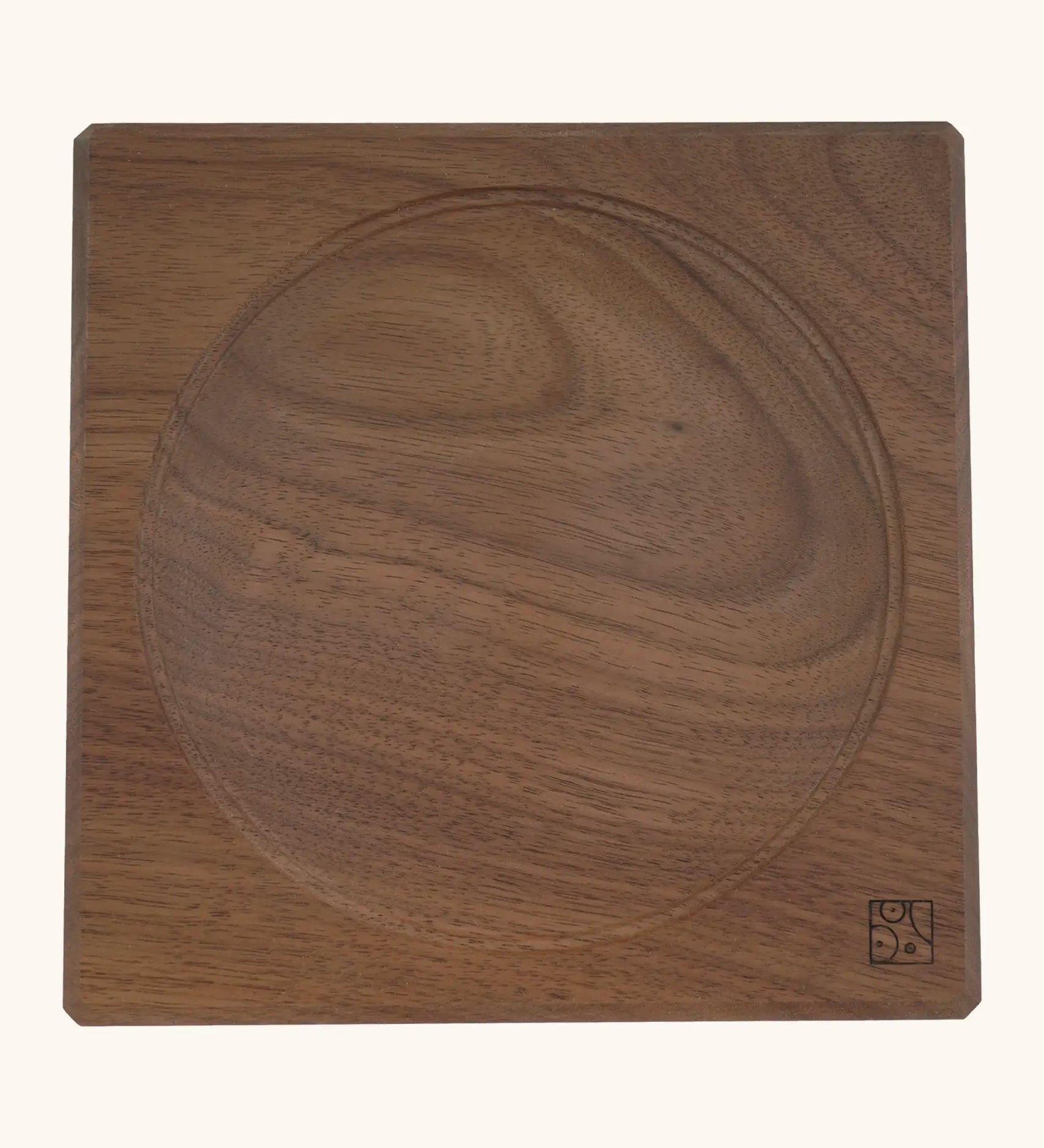 Mader handcrafted walnut square medium spinning top plate. Showing the logo on the bottom corner