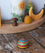 Mader striped wooden magnet placed on a desk in the Babipur playroom.