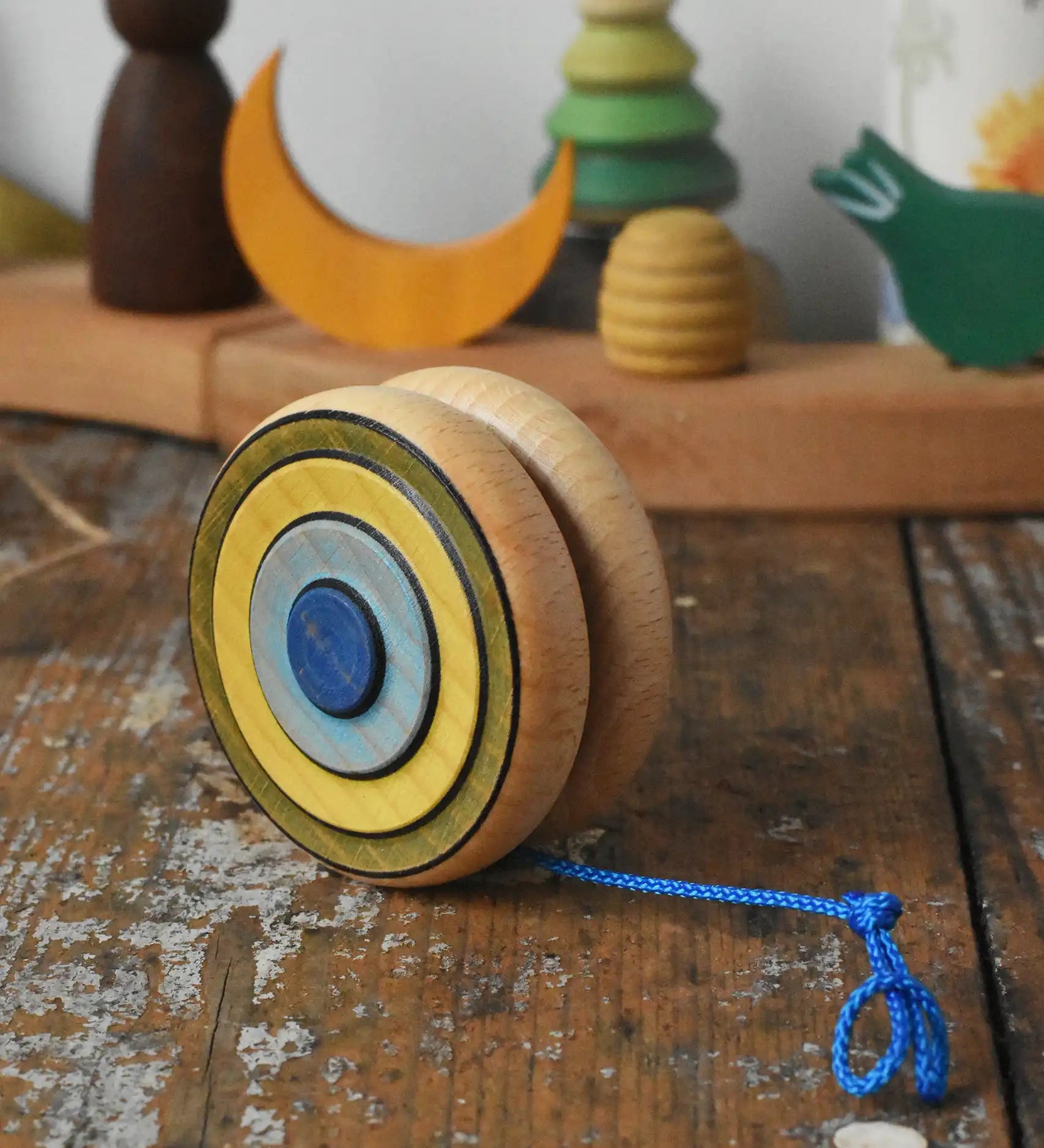 Mader Kreiselmanufaktur yoyo harlequin placed on a wooden desk in the Babipur playroom.
