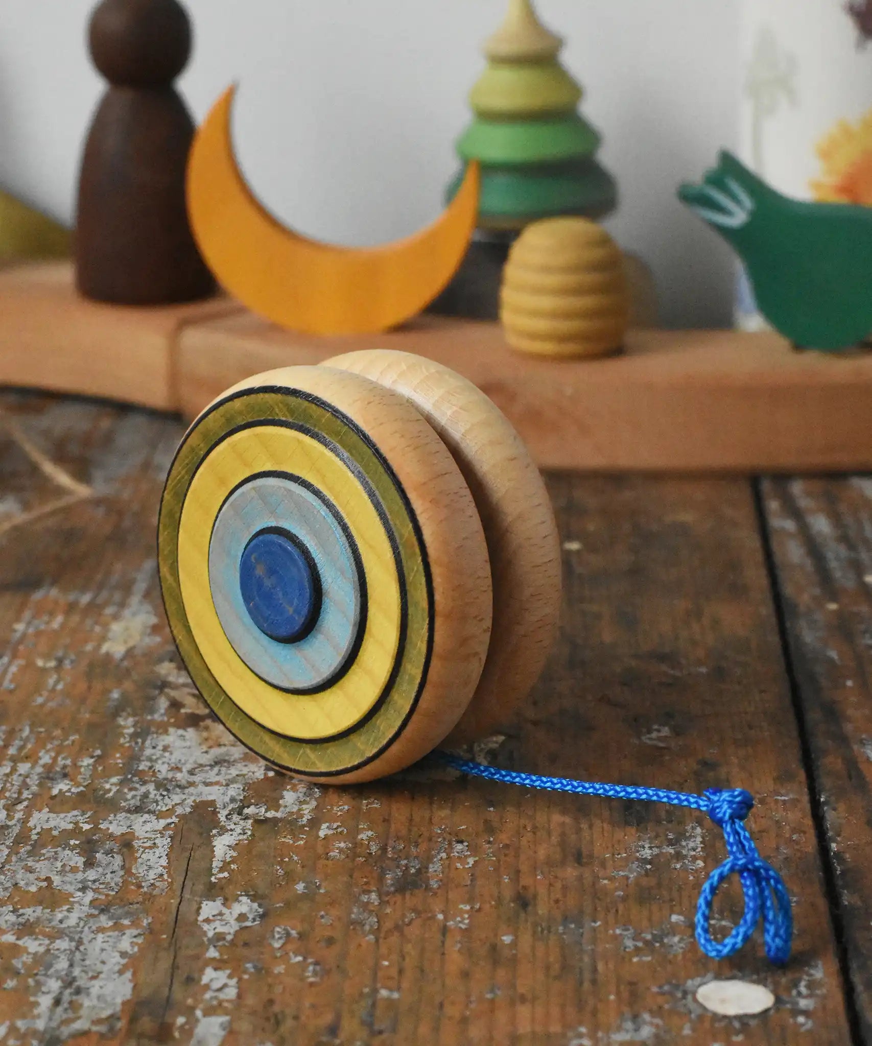 Mader Kreiselmanufaktur yoyo harlequin placed on a wooden desk in the Babipur playroom.
