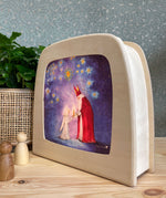 The gift of light silhouette shown in the toverlux magic lamp. 