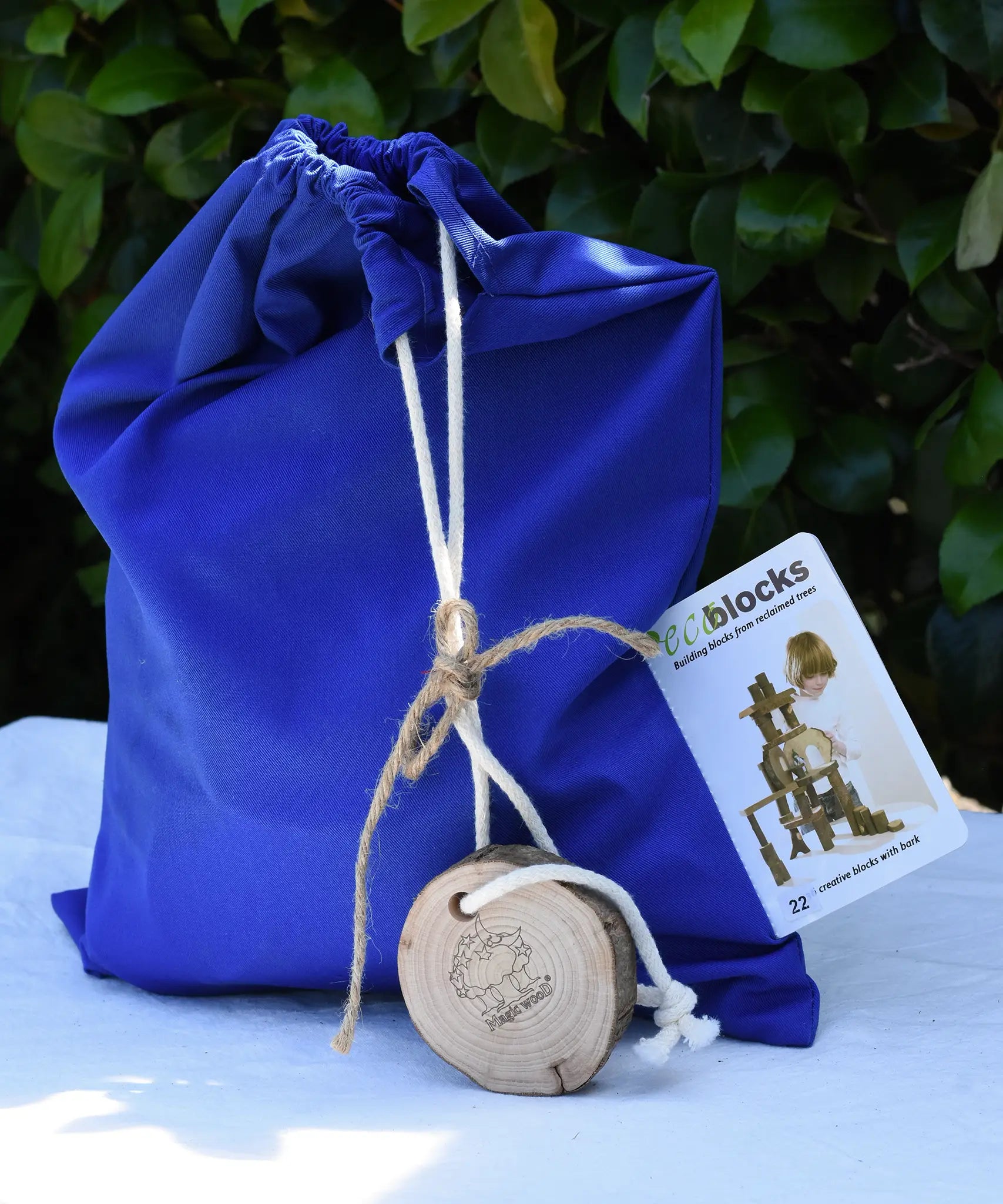 Magic Wood Eco Blocks in a 22 piece set in a blue drawstring storage bag.