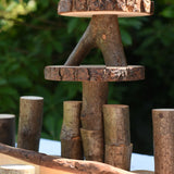 Close up of some stacked log slices and logs from the Magic Wood oiled ecoBlocks 36 piece set.