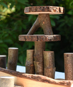 Close up of some stacked log slices and logs from the Magic Wood oiled ecoBlocks 36 piece set.