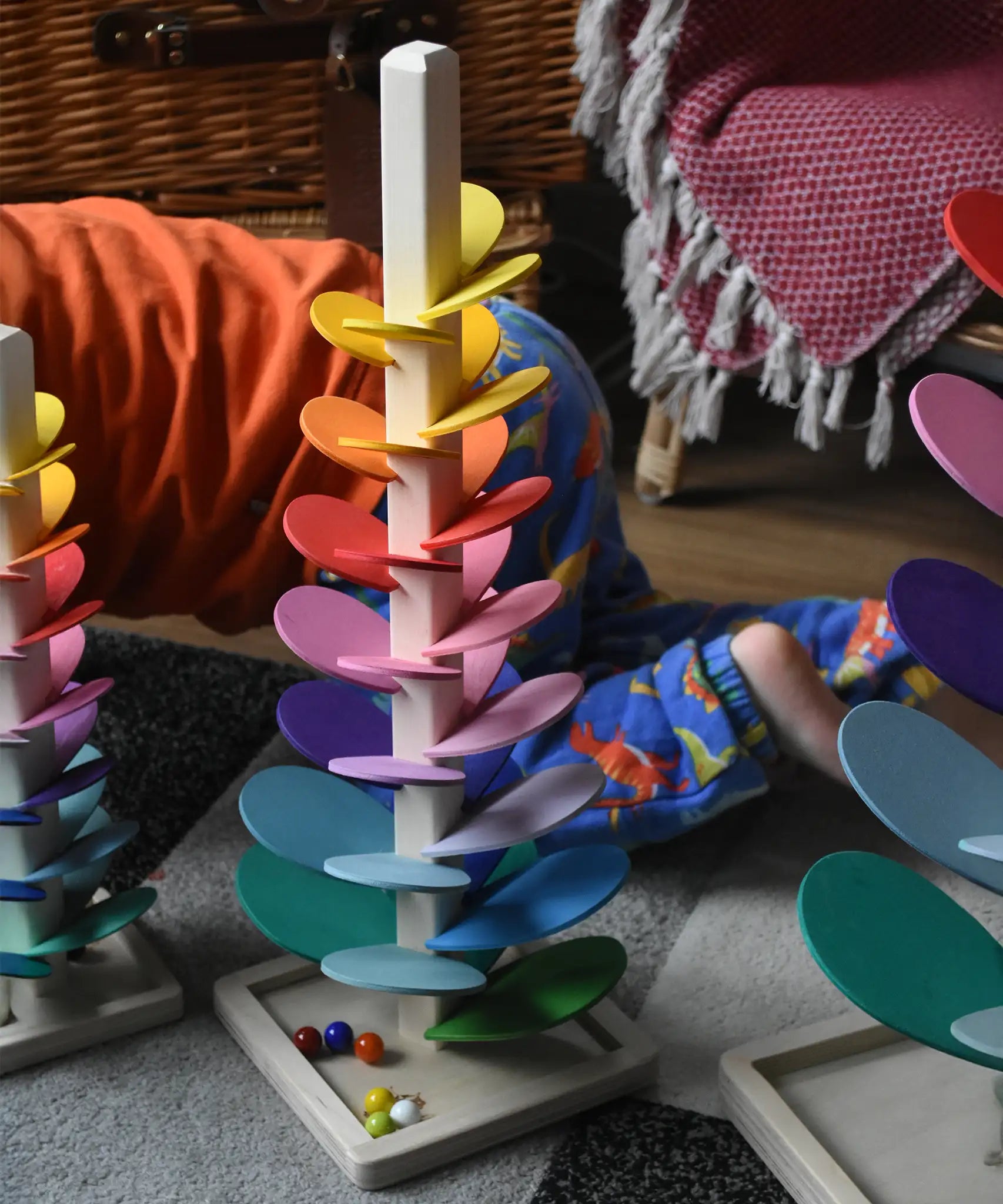 The small Magic Wood marble tree placed on the floor the mini and large marble trees can be seen just off to the side.